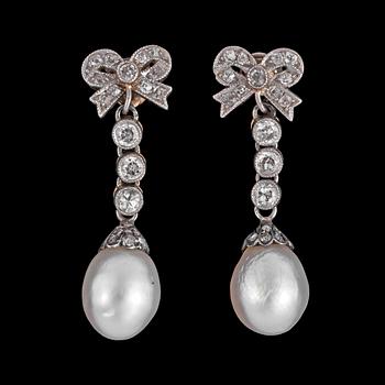 1299. A pair of pearl and diamond earrings.