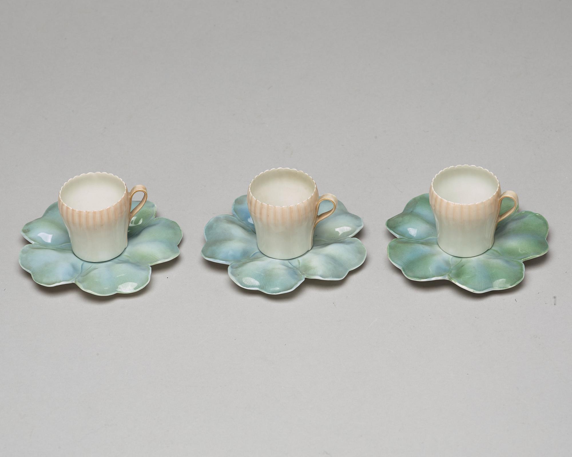 A set of six (3+3) cups with stands, Denmark, Bing & Gröndahl, early 20th Century.