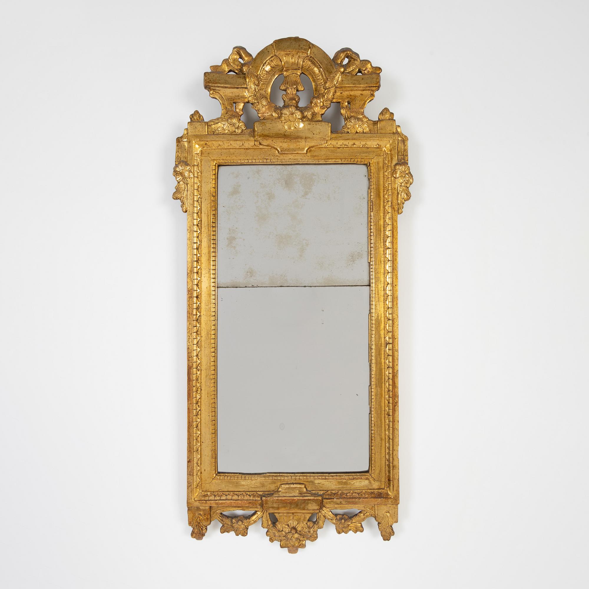 A Gustavian mirror by Johan Åkerblad, master in Stockholm 1758-99), signed.