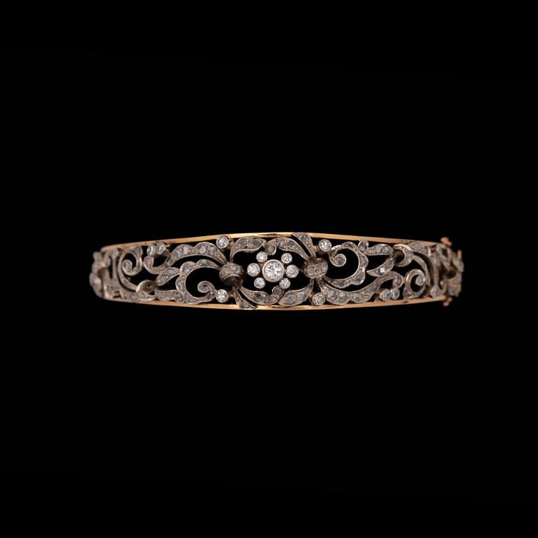 A brilliant- and rose cut diamond bangle.