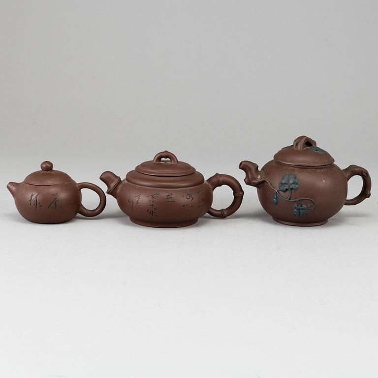 A group of three yixing pots, 20th century.