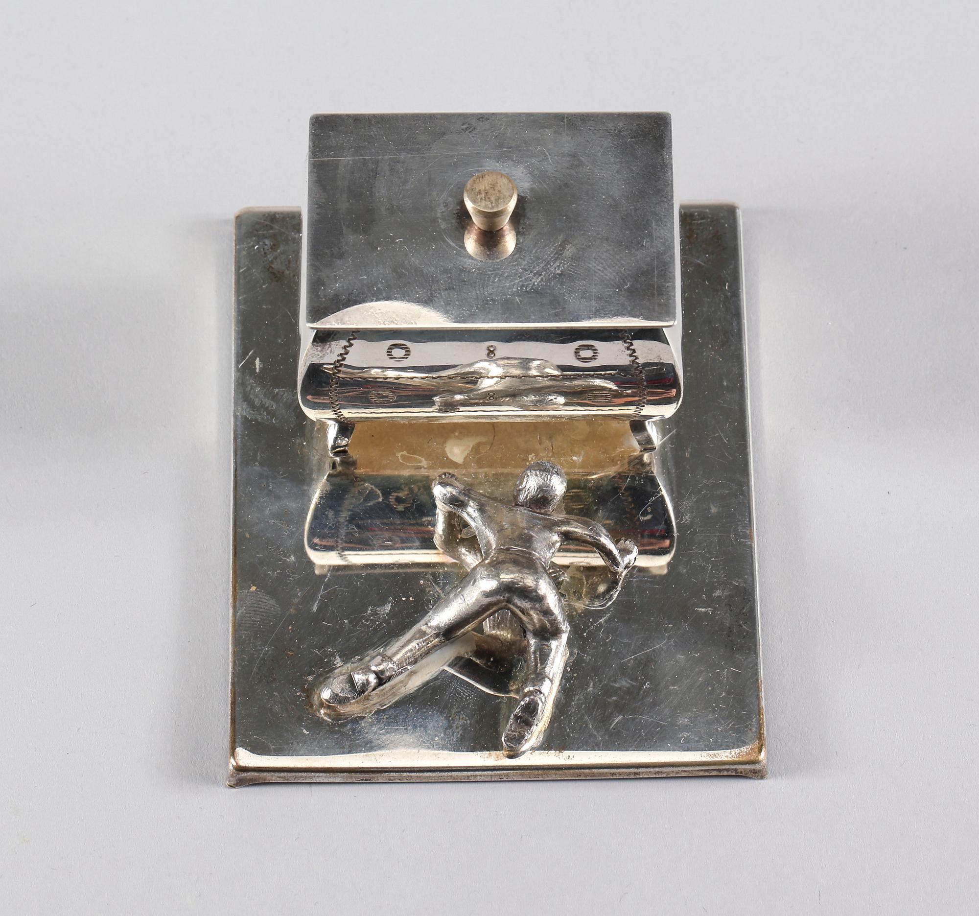 MANSCHETTKNAPPSASK, Eskilstuna, 1900-talets andra hälft.