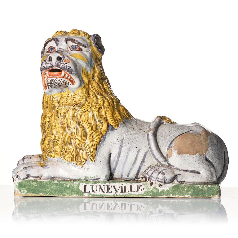 A pair of Luneville recumbent lions, circa 1780-1800.