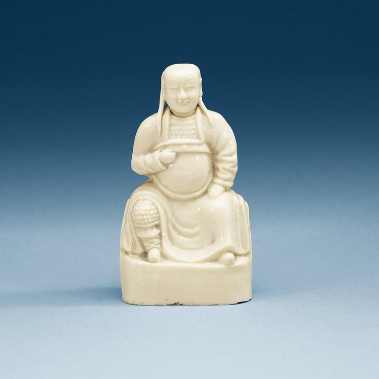 A blanc de Chine figure of a dignitary, Qing dynasty, Kangxi (1662-1722).