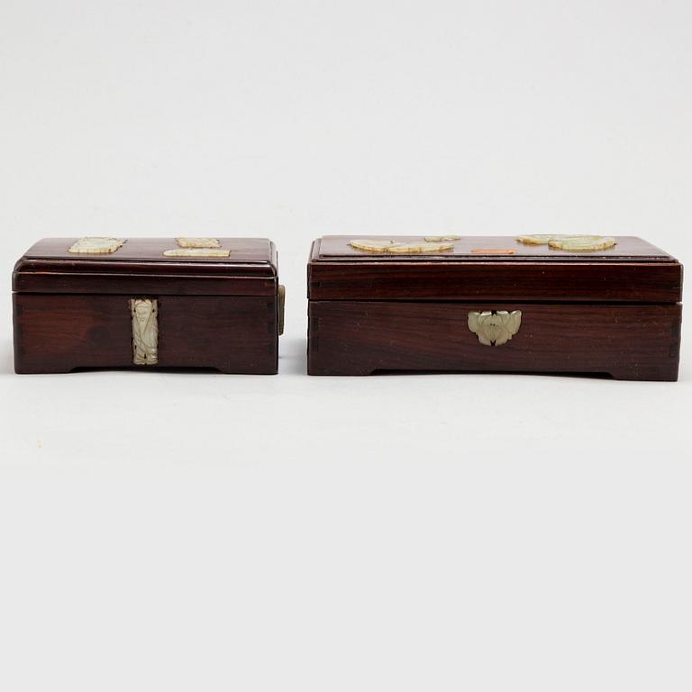 Two Chinese wooden boxes with covers, with nephrite objects, 20th century.