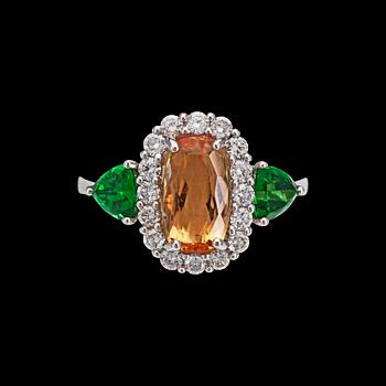 888. A topas, 2.95 cts, tsavorite and brilliant cut diamond ring, tot. 0.55 cts.