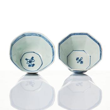 A pair of octagonal blue and white cups with stands, Qing dynasty, Kangxi (1662-1722).