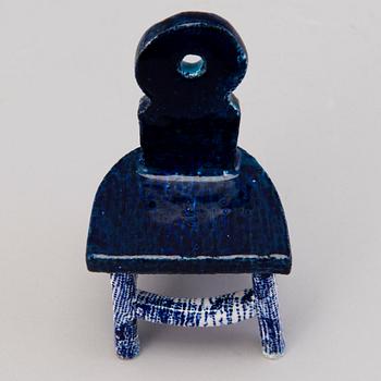 HEINI RIITAHUHTA, a porcelain miniature sculpture 'Chair' signed Heini Riitahuhta.