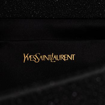 Yves Saint Laurent, a sparkly black leather clutch.