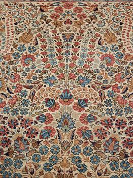 A semi-antique/old Kerman carpet, around 361 x 264 cm.