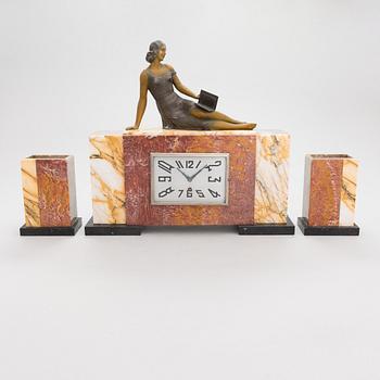 A signed S. Milan, French Art Deco 3 piece mantle clock by Marti dating to the 1920'/30s.