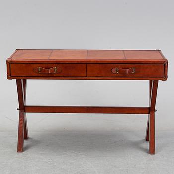 A contemporary dressing table with stool.