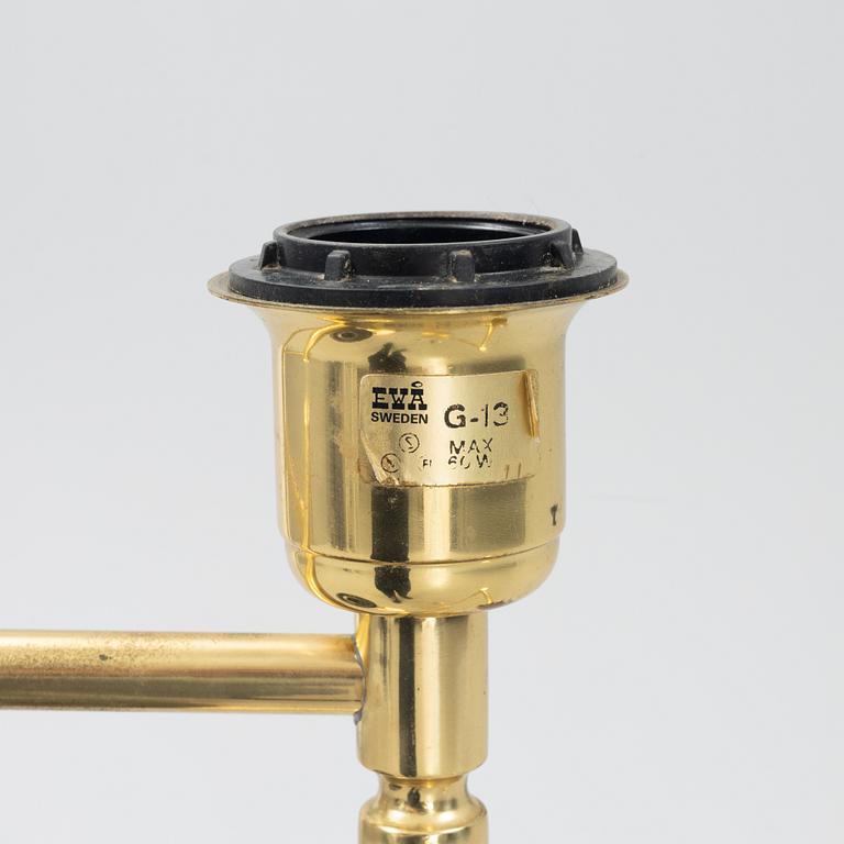 A pair of brass floor lamps, EWÅ, Sweden, second half of the 20th century.