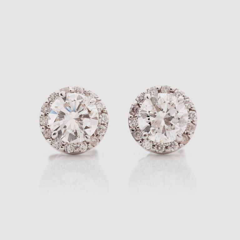 A pair of brilliant-cut diamond solitaire earrings. Total carat weight circa 2.44 cts.