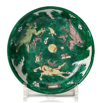 963. A green yellow and aubergine glazed dish with flying horses, Qing dynasty, Kangxi (1662-1722).