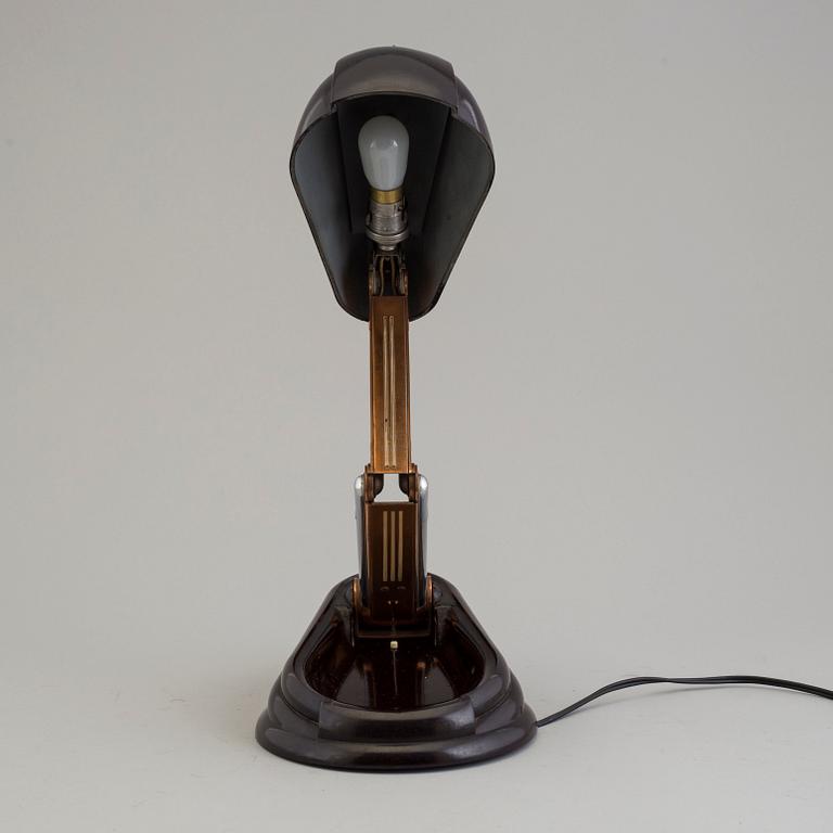 a bakelite and metal table 'Bolide' table lamp, by JUMO, 1940's.