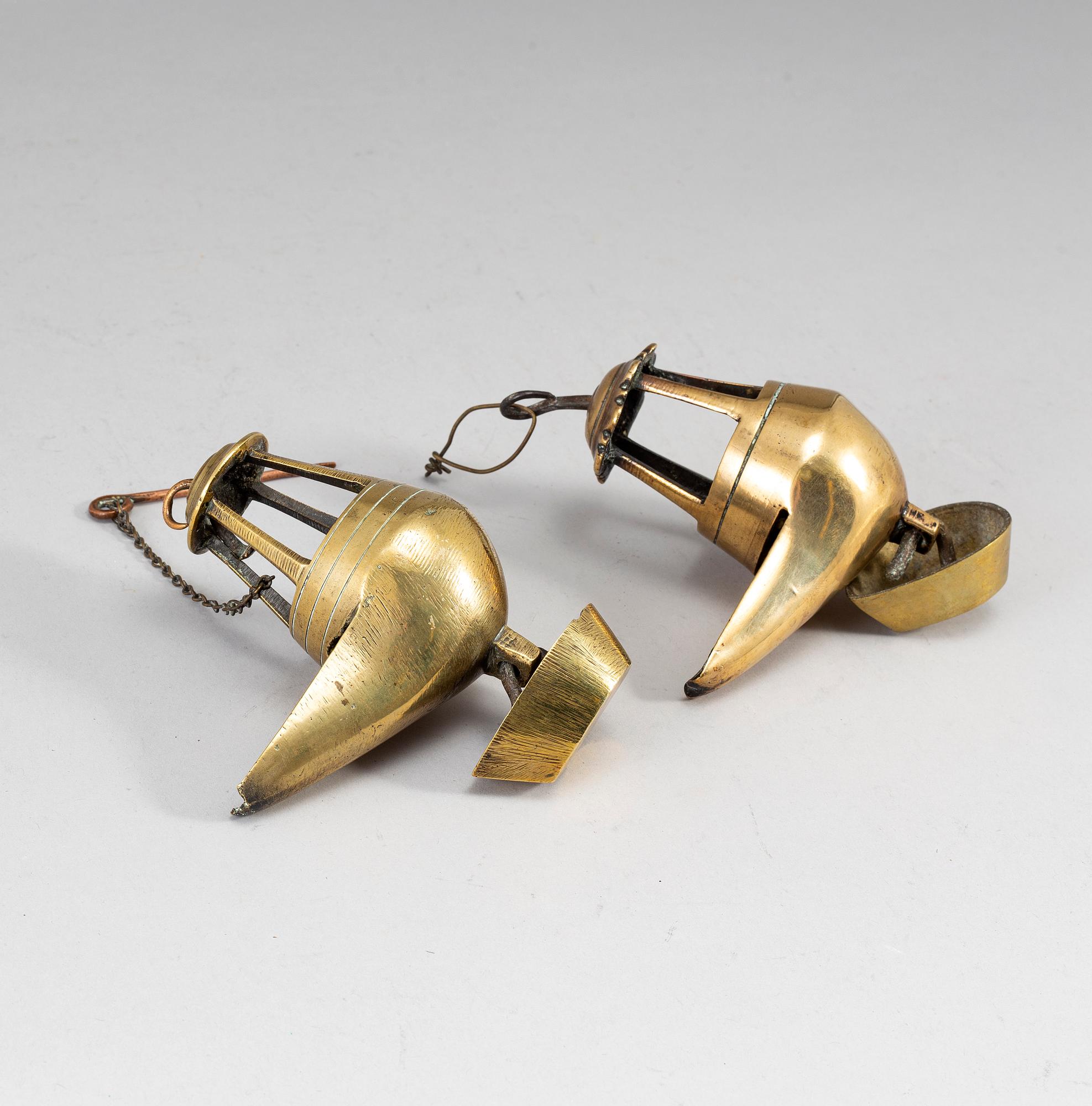 Two 18th century bronze oil lamps.