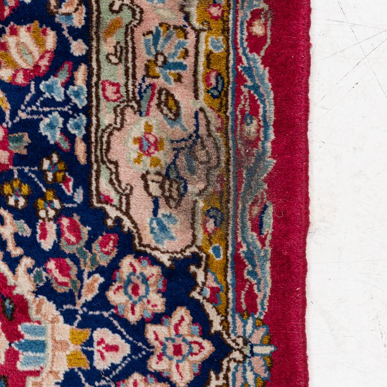 A Kirman carpet, signed, c. 388 x 279 cm.