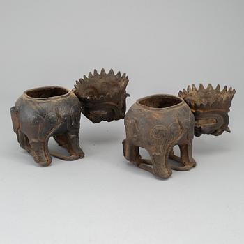 A pair of Chinese iron Fo dogs, 20th Century.