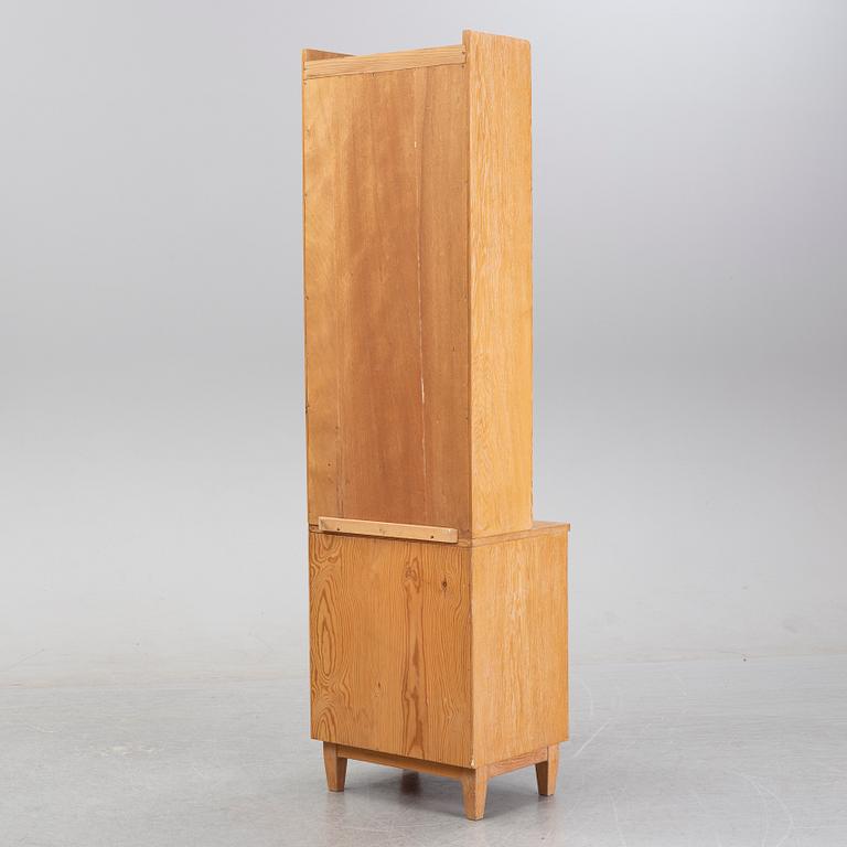 An oak book case with a cabinet, second half of the 20th Century.