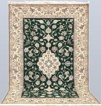 A part silk Nain rug, so-called 9LAA, approx. 257 x 161 cm.