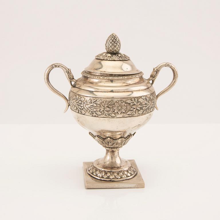 A three pcs Empire silver tea service unknown hallmarks, toal weight 1133 grams.