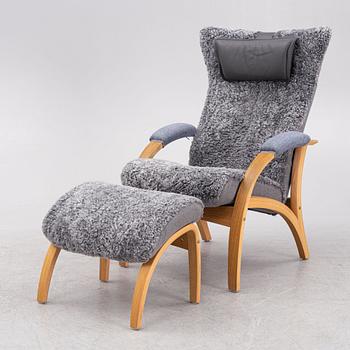 A 'Delta Adventure' armchair with ottoman, Brunstad, Norway.