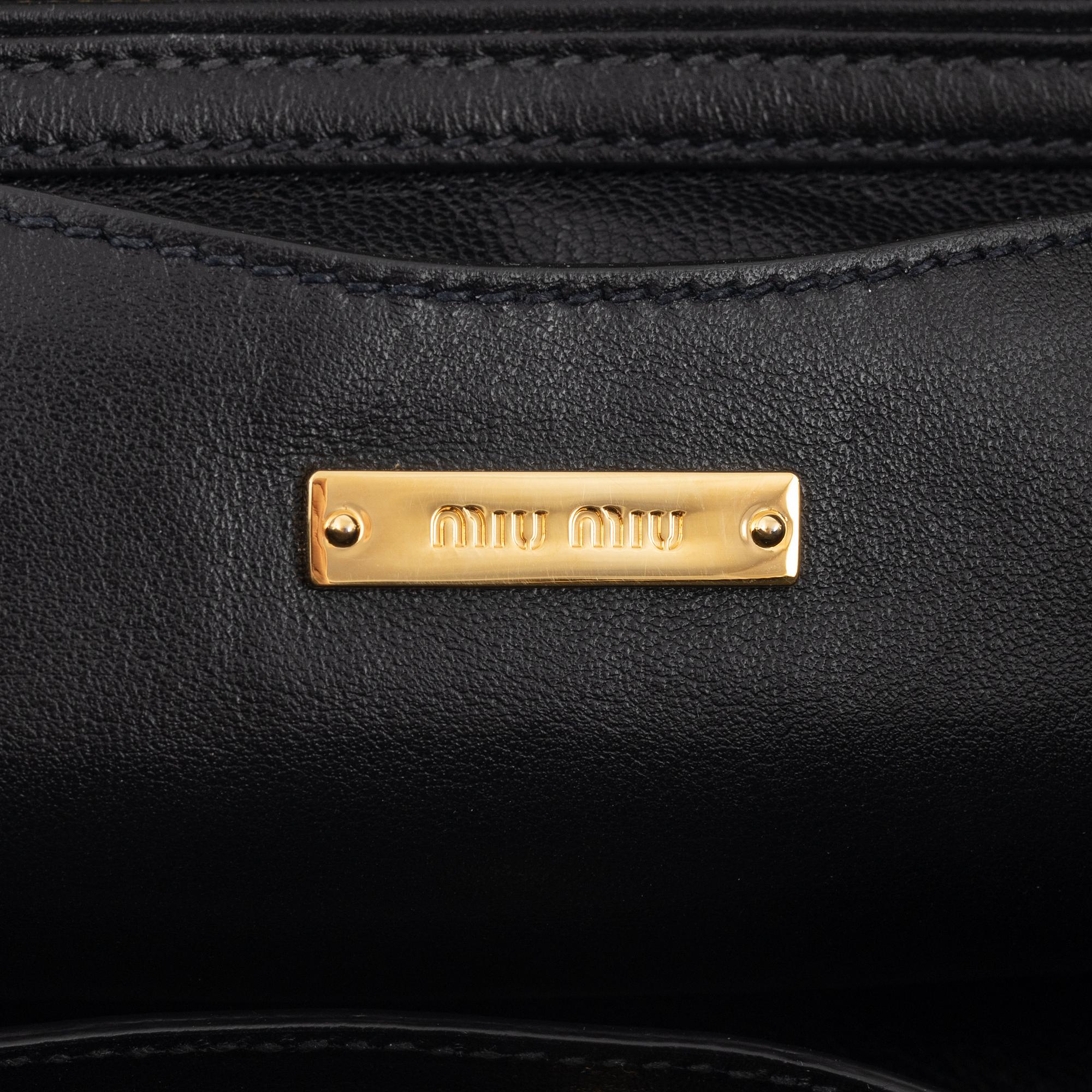 Miu Miu, a black leather handbag.
