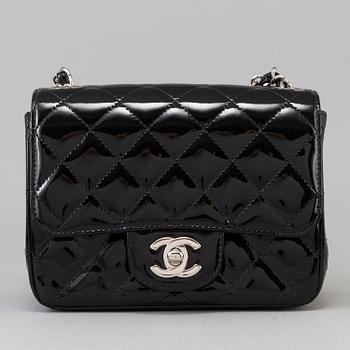 A black lacquer "Classic mini" bag by Chanel 2009-2010.