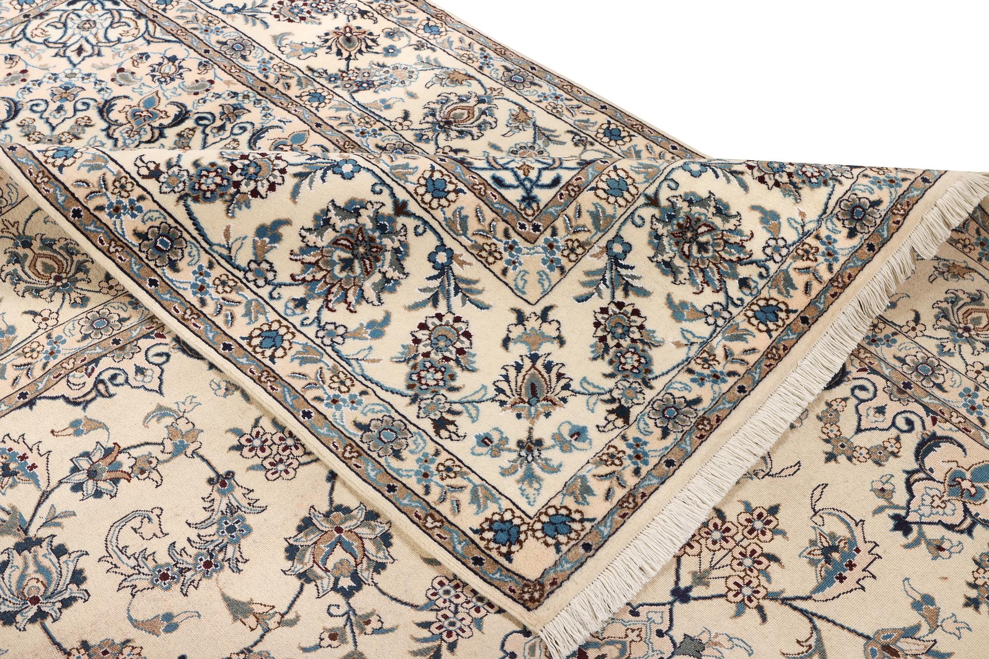 A Nain, part silk carpet, c. 337 x 244 cm.