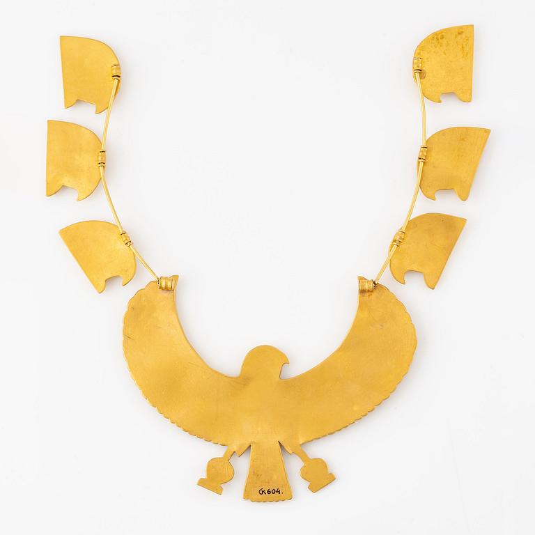 A modern Egyptian-style gold necklace.