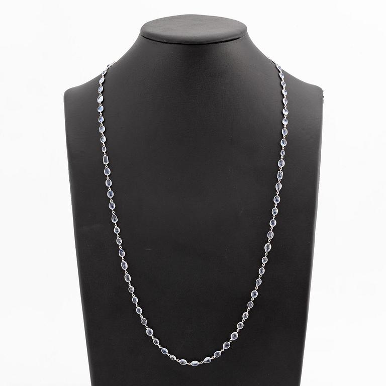 An 18K white gold necklace set  with faceted sapphires.