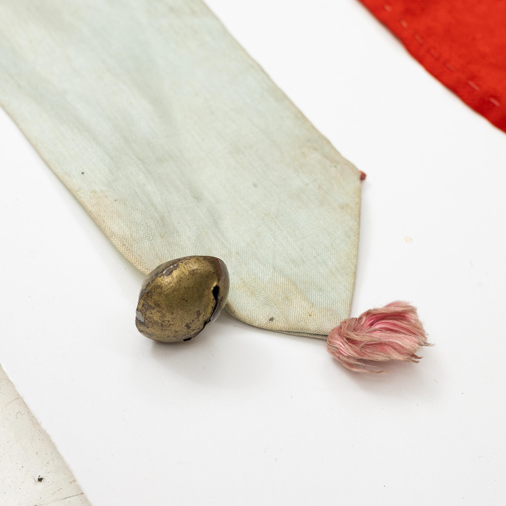 A Chinese embroidered triangular silk banner, late Qing dynasty/possibly early 20th century.