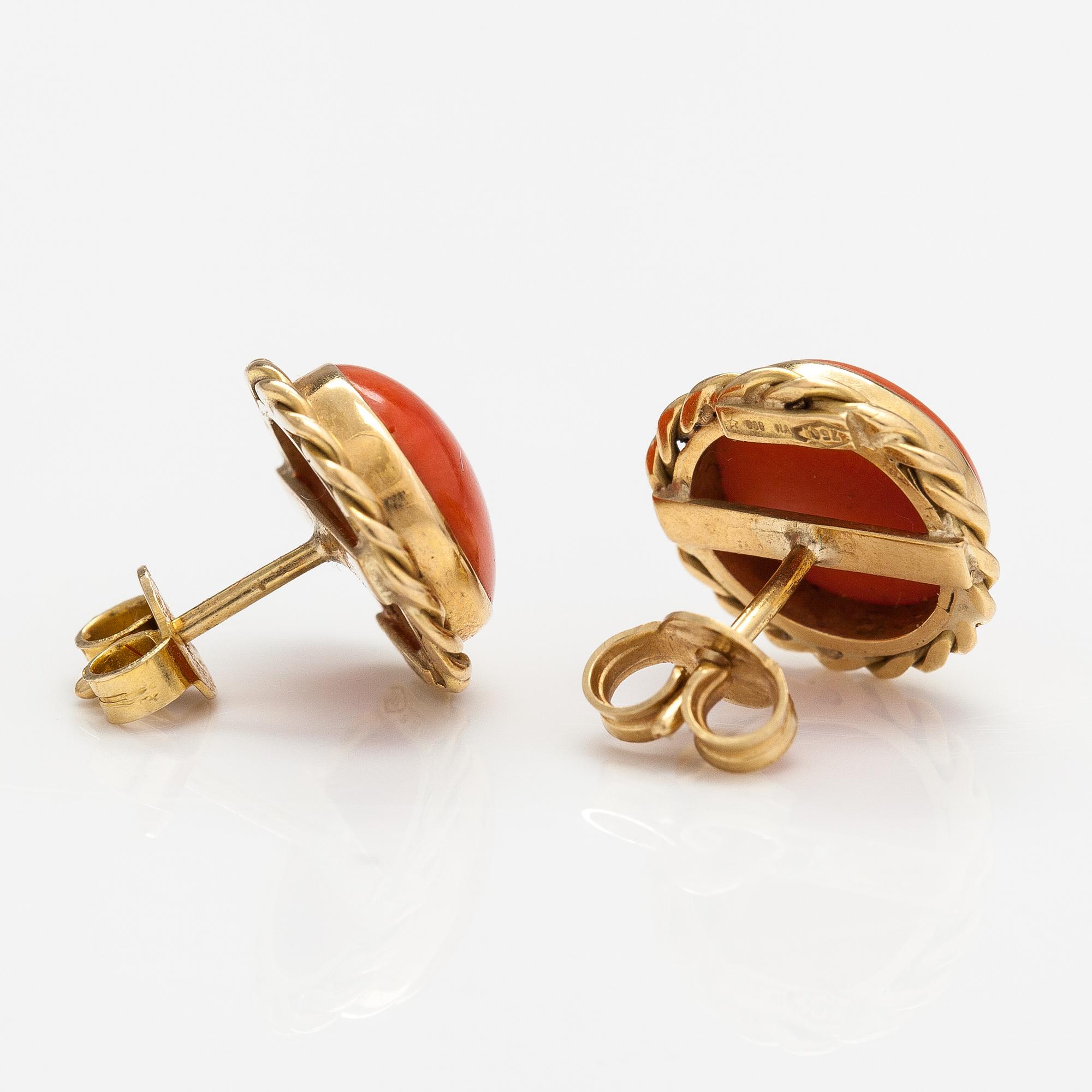 A pair of 18K gold earrings with coral.