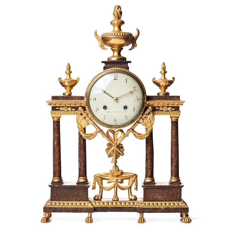 A late Gustavian porphyry imitation and gilt wooden mantel clock by Wilhelm Pauli (clockmaker in Stockholm 1795-1809).