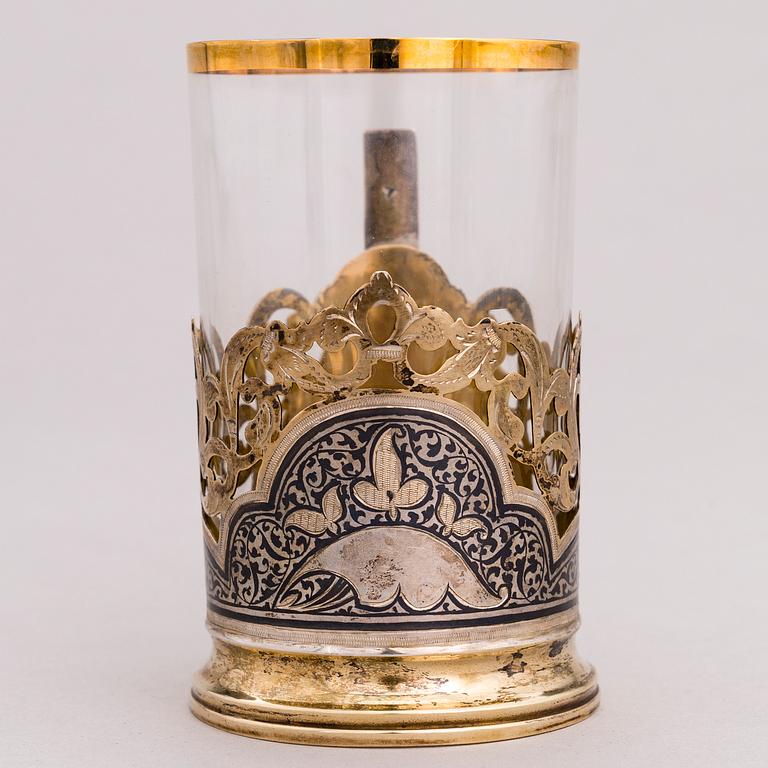 A Russian silver teaglass holder and seven teaspoons, Moscow and Kiev, first half and mid-20th Century.