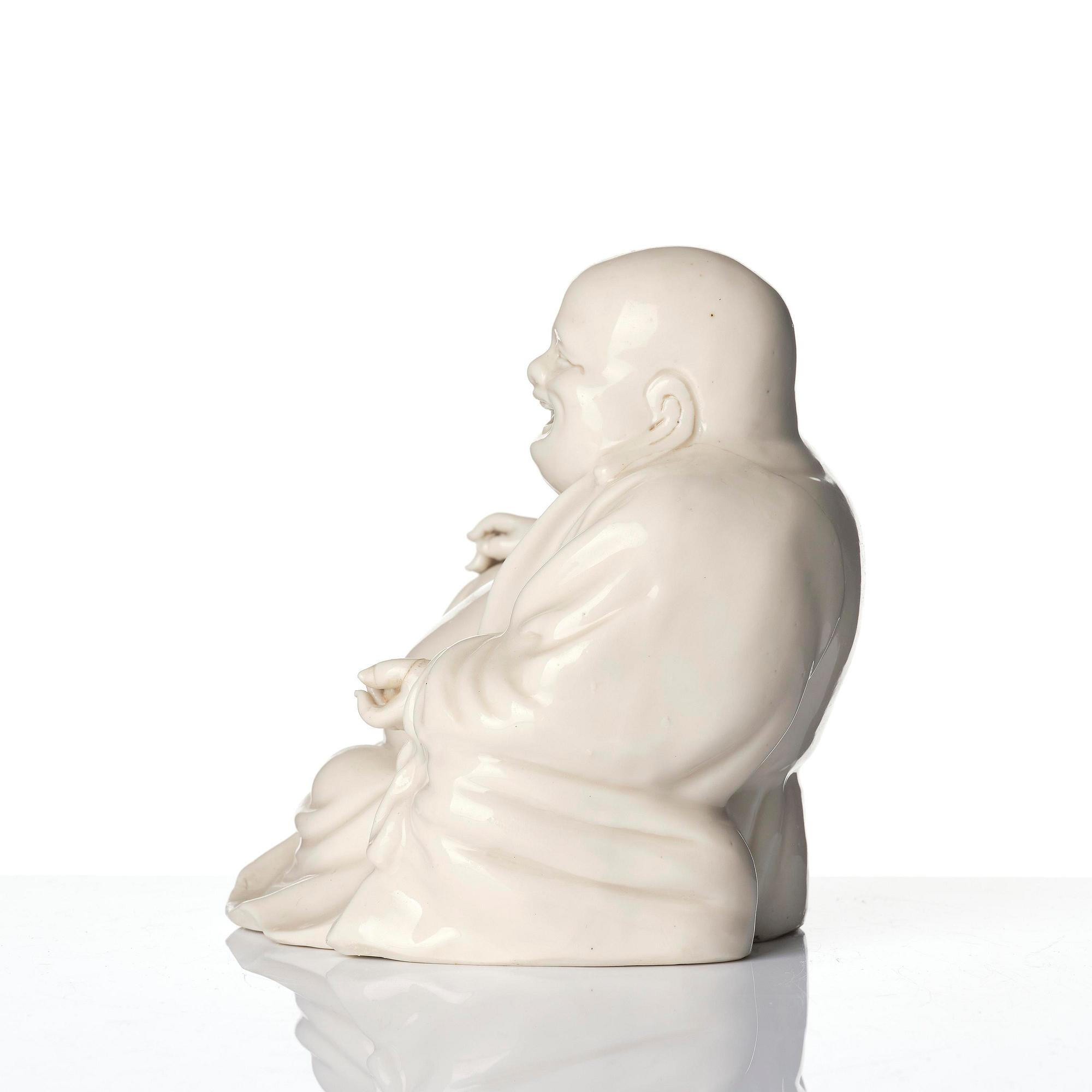 A blanc de chine figure of Budai, Qing dynasty, 18/19th century.