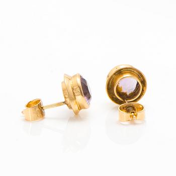 A set of 14K gold earrings and a ring with amethysts.