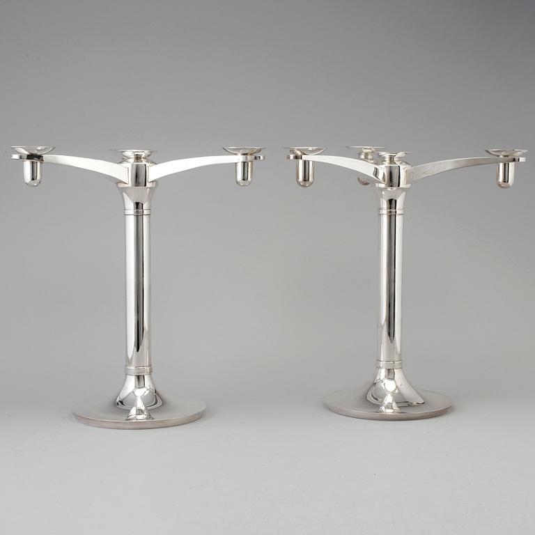 RICHARD FOX, a pair of three armed, four light sterling candelabra, London, 2001 and 2013.