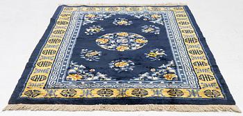 A semi-antique silk Chinaese 'Antique finish' rug, c. 175 x 122 cm.