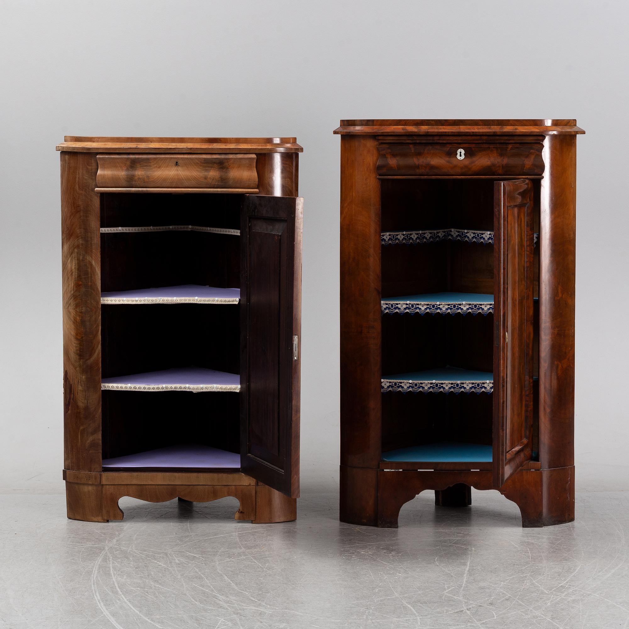 A pair of mahogany corner cabinets, mid 19th Century.