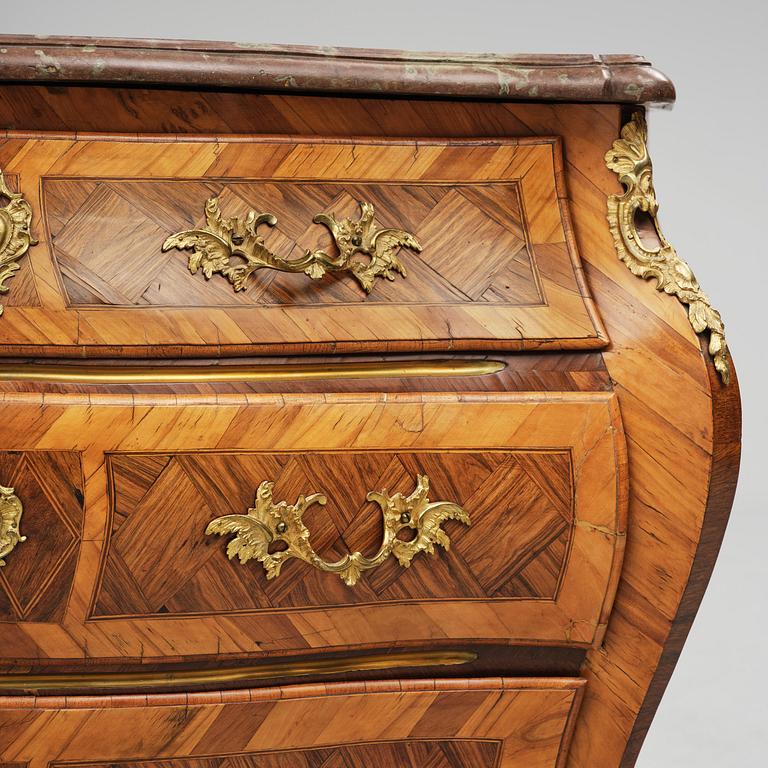 A rococo parquetry and gilt brass-mounted commode attrbuted to M. Engström (master in Stockholm 1758-97).