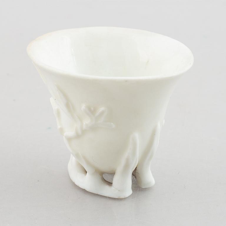 A blanc de chine rhinoceros libation cup, Qing dynasty, 18th century.