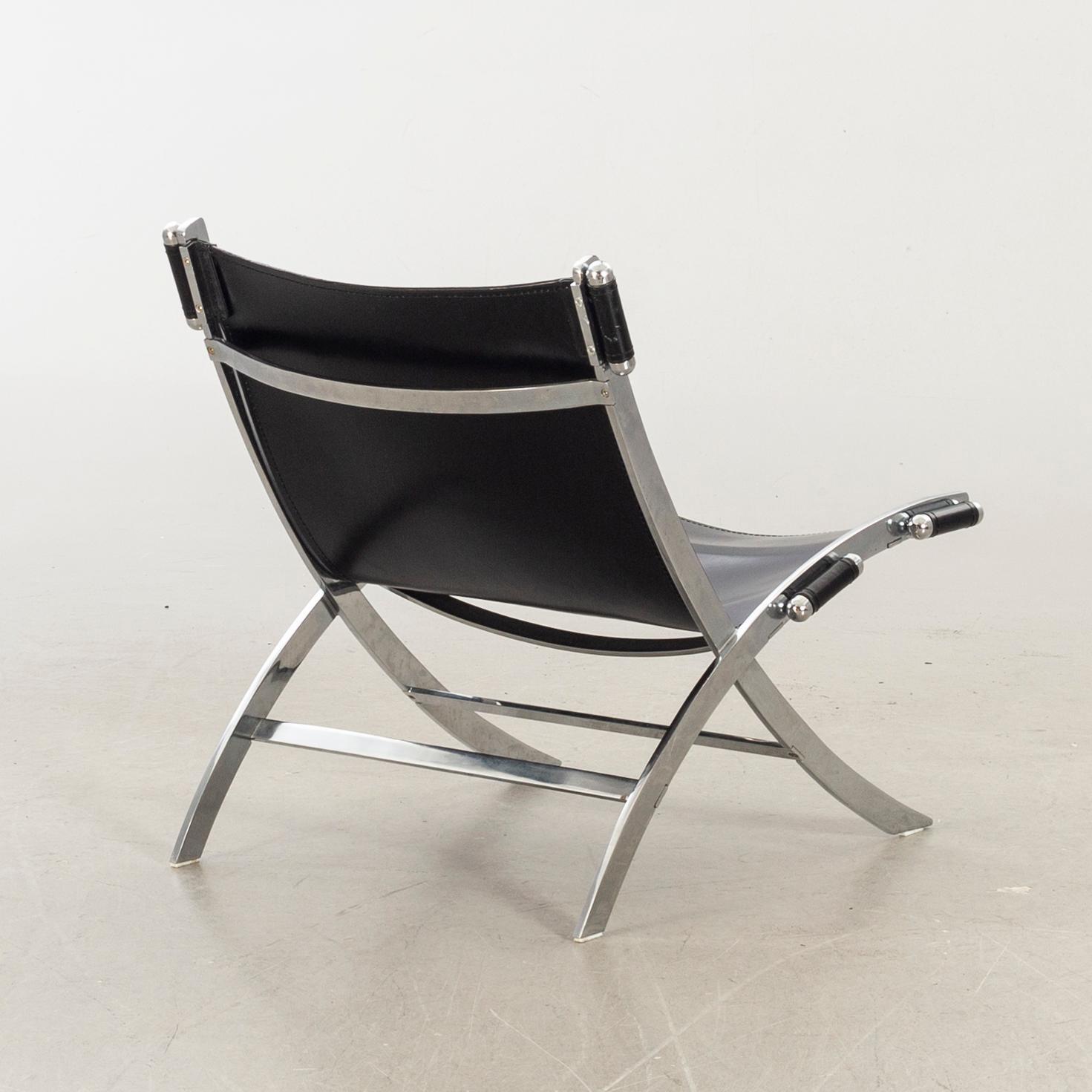 Paul Tuttle For Flexform Lounge Chair In Chrome And Black Leather.