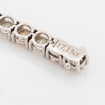 Round brilliant-cut diamond rivière bracelet, with IGI report.