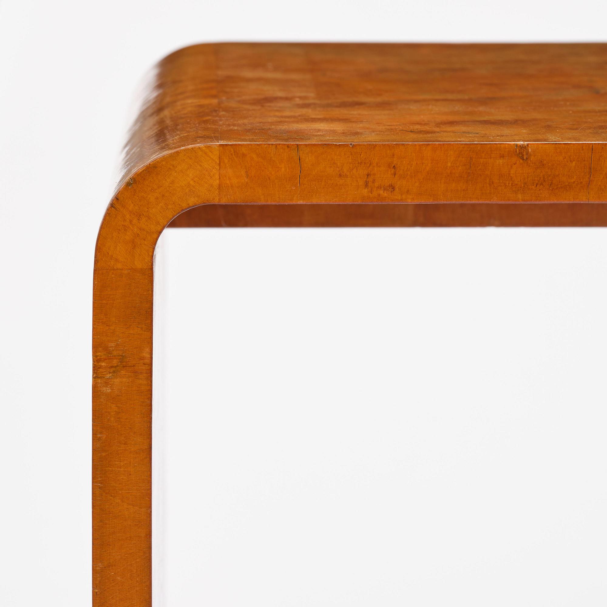 Swedish Modern, a birch veneered coffee table, 1930s-40s.