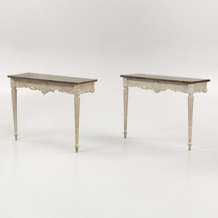 A pair of Louis XVI-style console tables, around the year 1900.