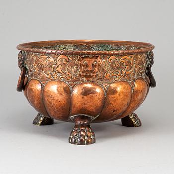 A 19th century copper champagne cooler.