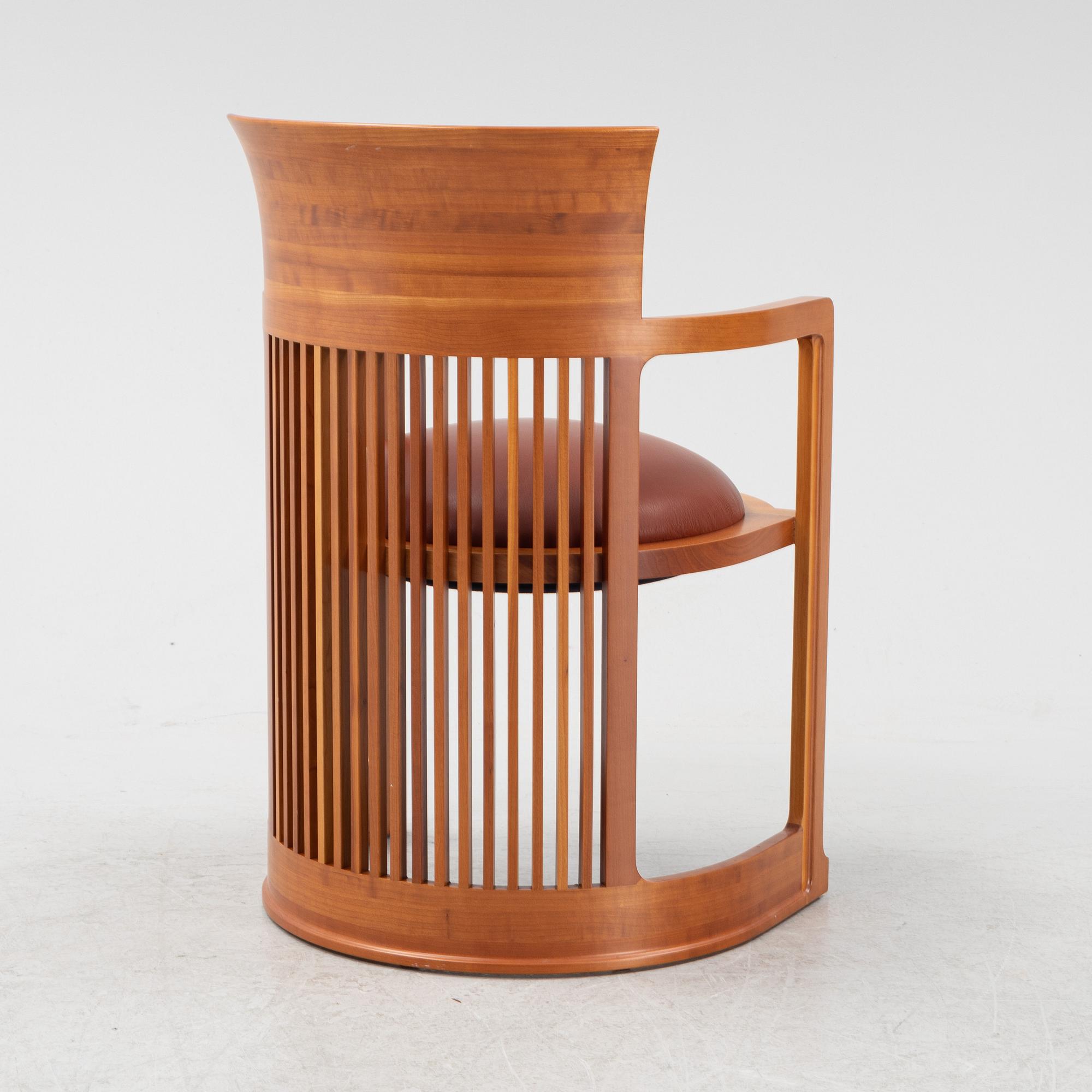 Frank Lloyd Wright, a model 606 'Barrel' chair from Cassina.
