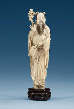 1495. A ivory figure of (Han) Zhongli Quan, Qing dynasty, circa 1900.